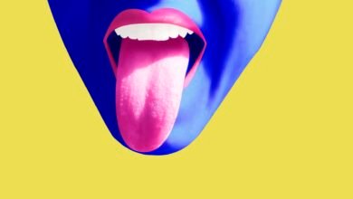 a colorful illustration of a face with a tongue sticking out