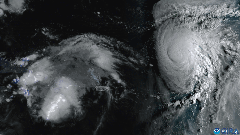 A satellite image of Hurricane Humberto strengthening as Tropical Storm Imelda develops.