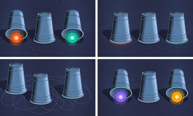 ستكون "الجسيمات شبه الجزئية" مملكة ثالثة للجسيمات الكمومية 1 A four-paneled illustration. In each panel, a number of three cups are lifted up to reveal different colored glowing orbs in different places