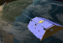 A concept illustration of the Gravity Recovery and Climate Experiment (GRACE) satellites over Earth.