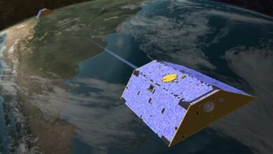 A concept illustration of the Gravity Recovery and Climate Experiment (GRACE) satellites over Earth.