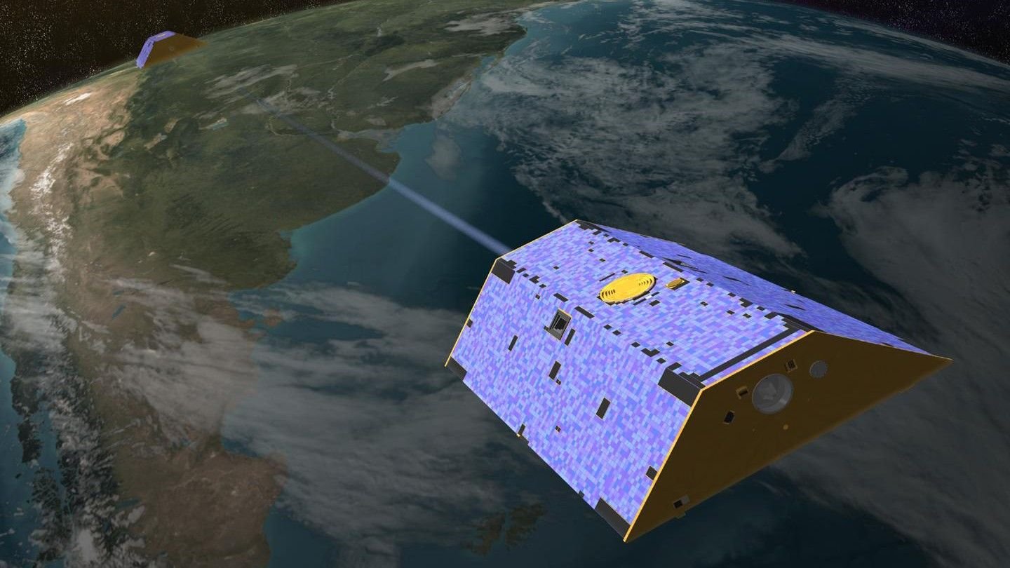 A concept illustration of the Gravity Recovery and Climate Experiment (GRACE) satellites over Earth.