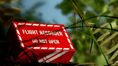 an airplane black box hidden by some plants