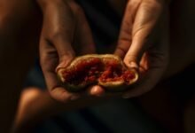 A photograph of a person holding an open fig
