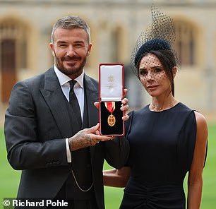 Arise, Sir David! Beckham finally receives his knighthood for services to sport and charity as former footballer arrives at Windsor Castle with wife Victoria and his parents 17 103576195 15256733 Sir David looked delighted while showing off his medal a 71 1762259823382