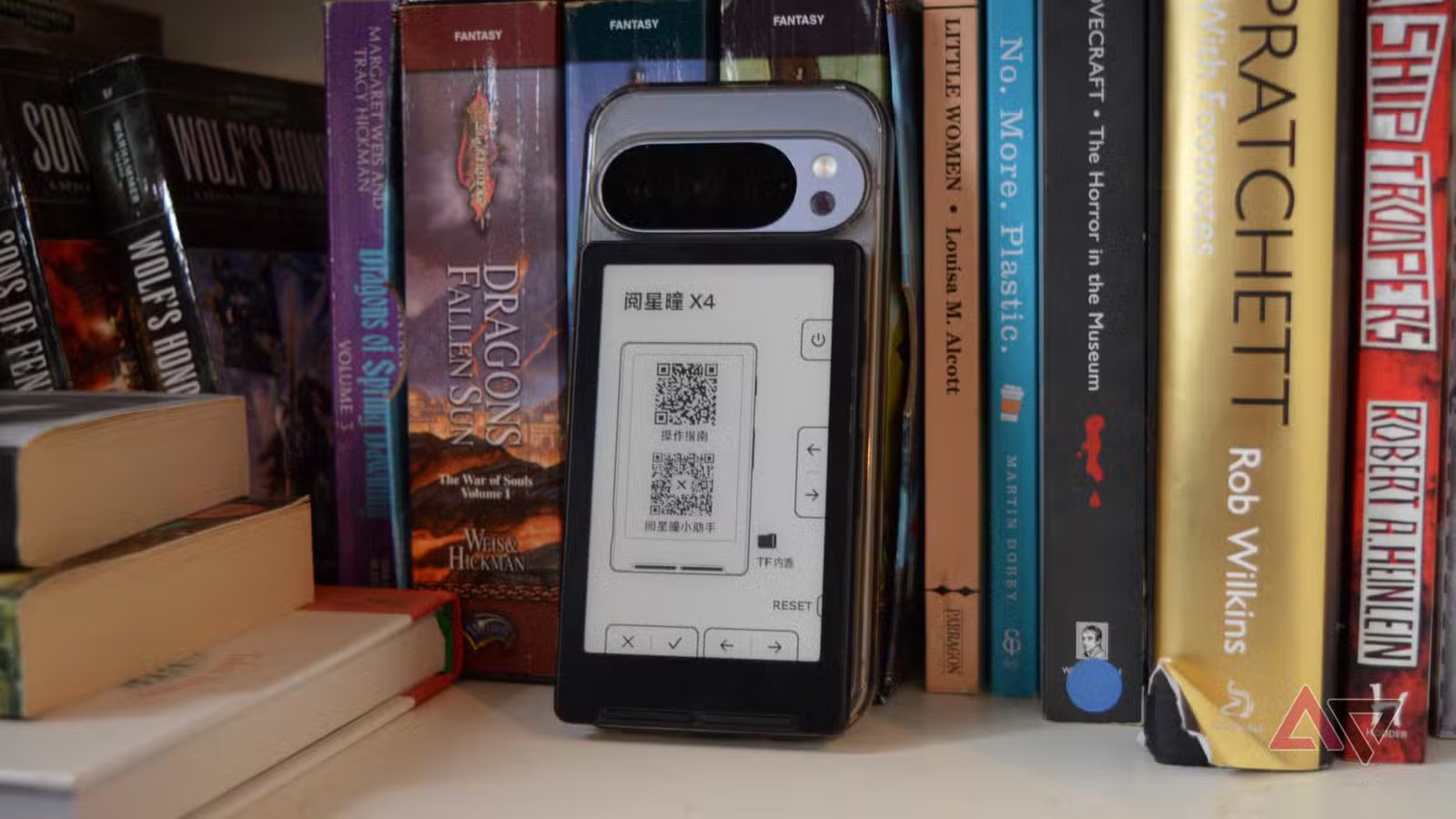 1768846773 724 xteink x4 propped by books front