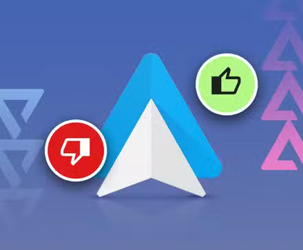 android auto logo flanked by thumbs up and thumbs down icons